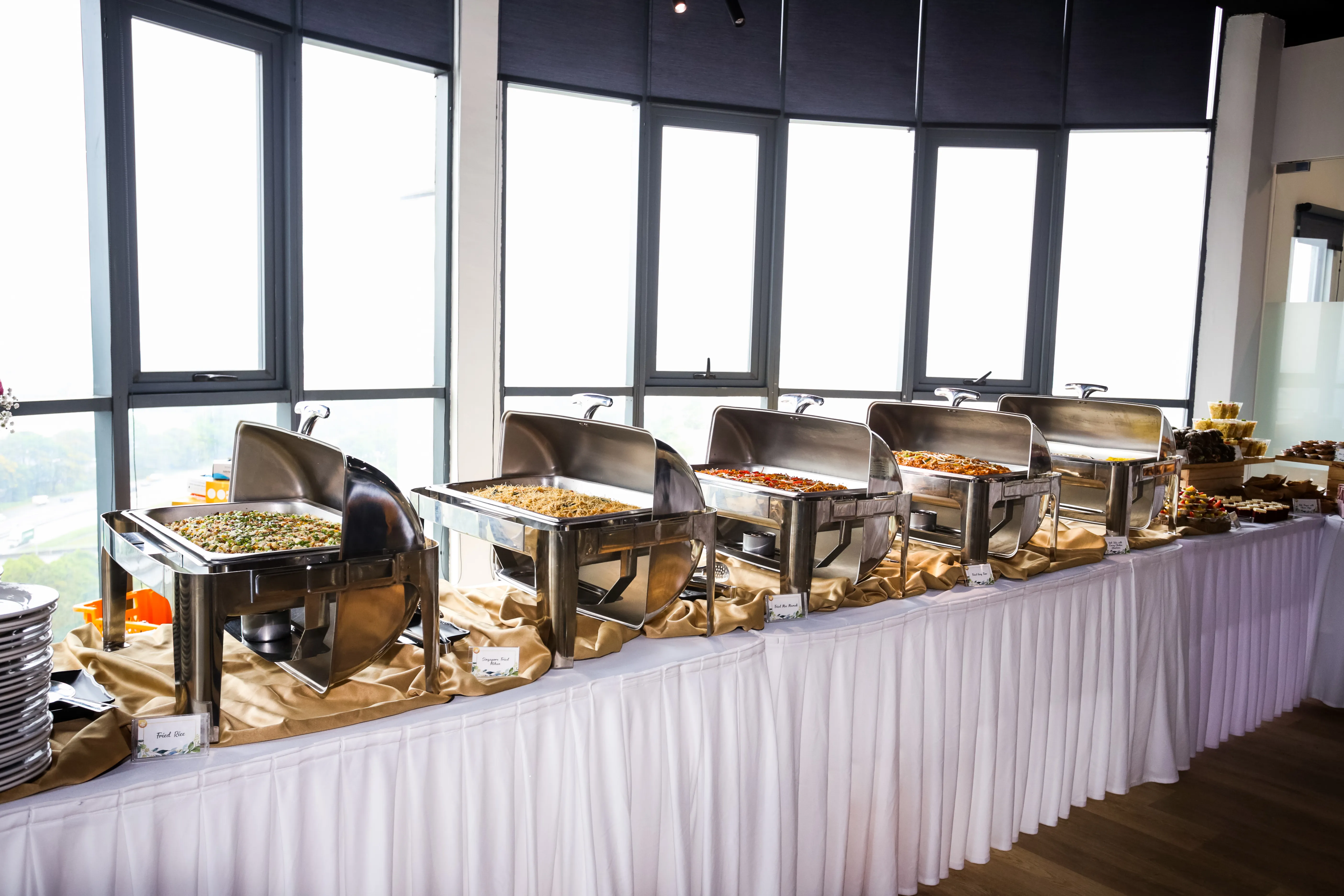 Buffet chafing dishes with fried rice and noodles for a meeting