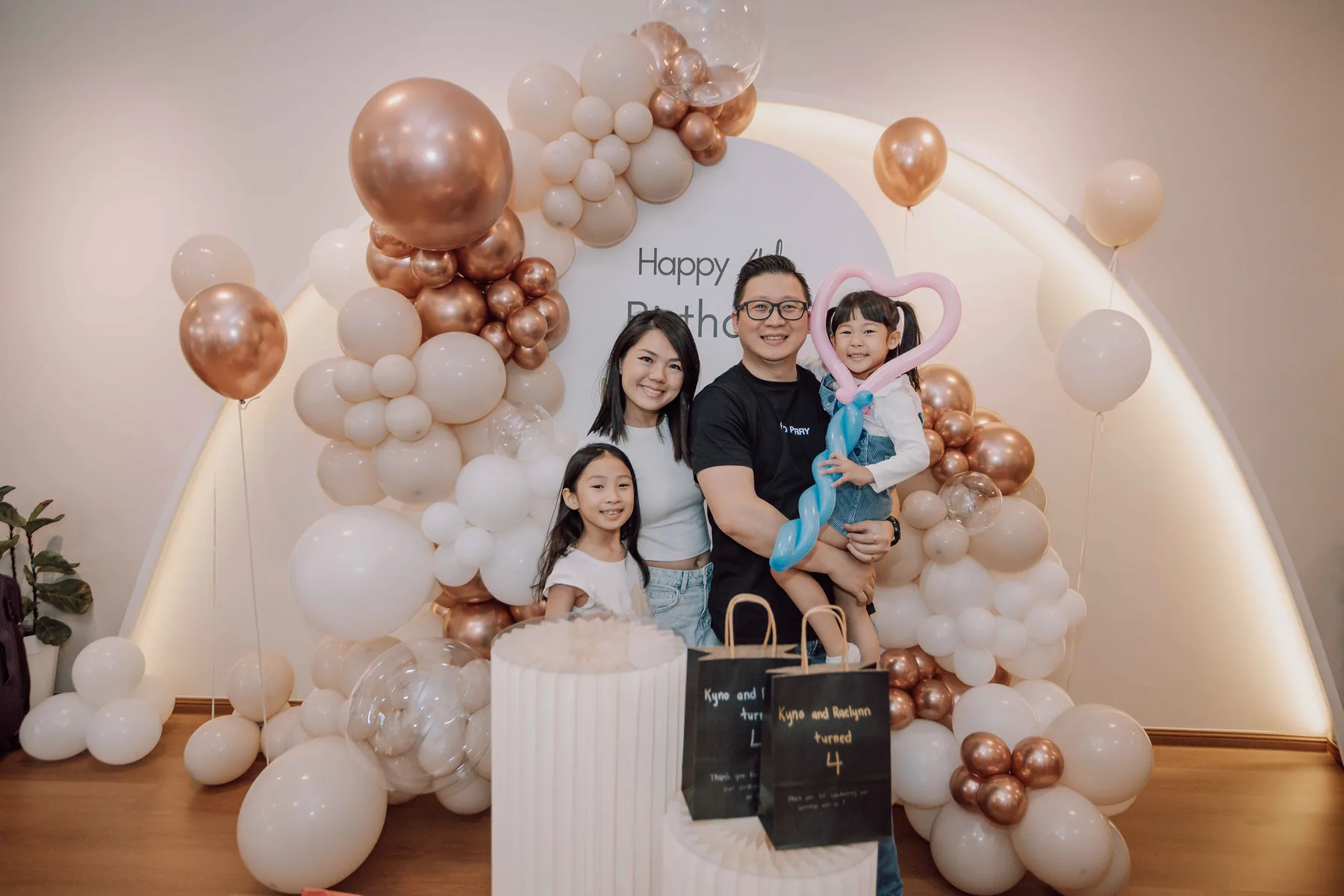 Parents celebrating happily with their children at a birthday party