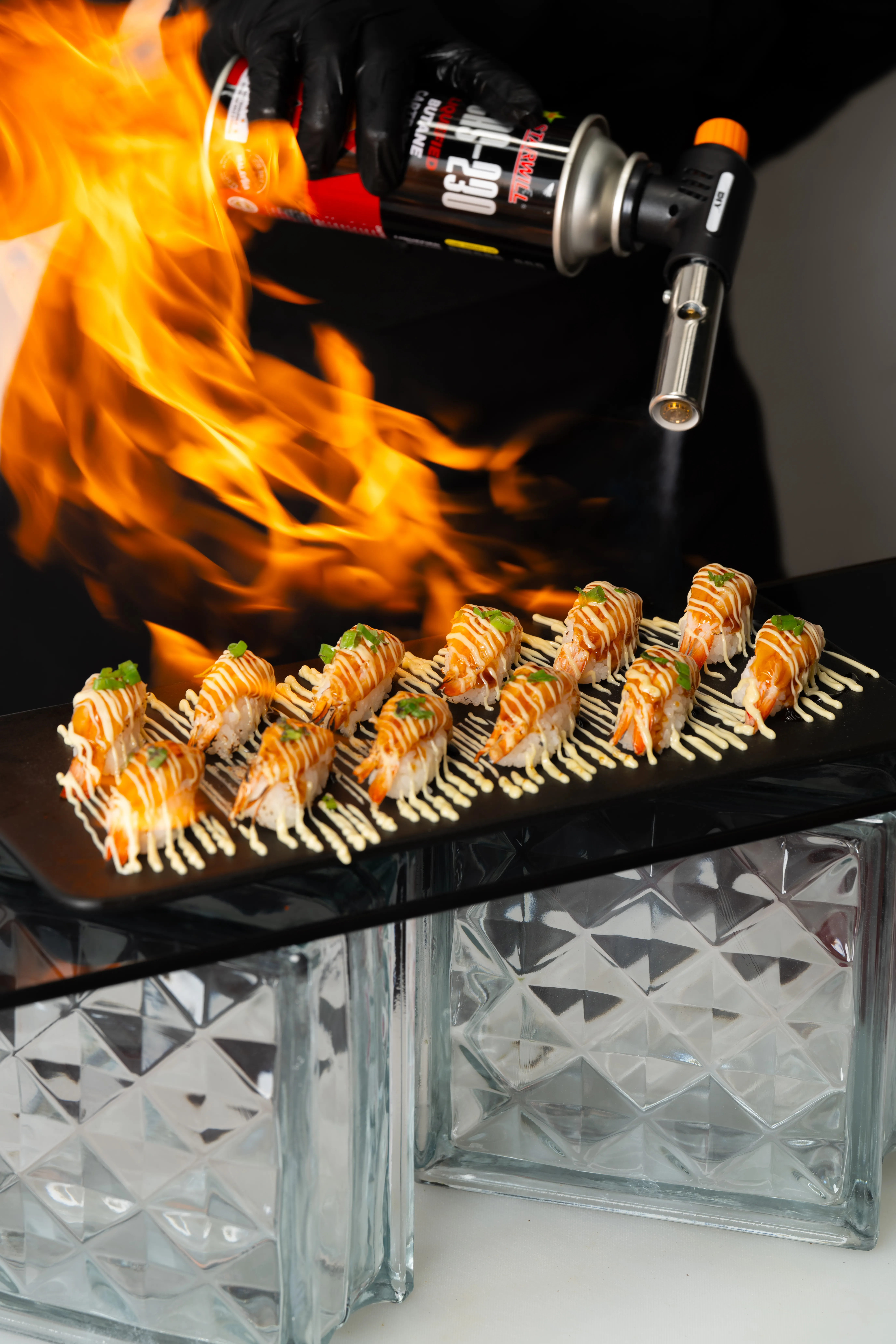 Flambe live station shrimp presentation for a wedding