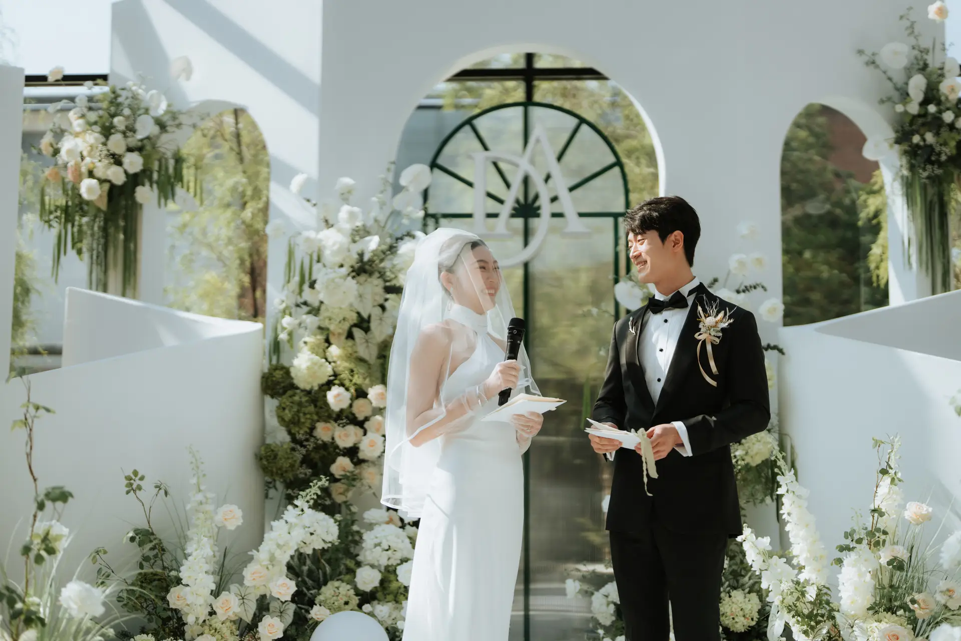 Bride and groom smiling during their wedding ceremony